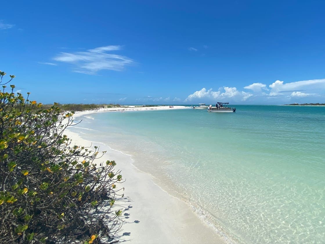 Boaters anchored at a shallow sandbar in Clearwater Harbor near Clearwater Beach