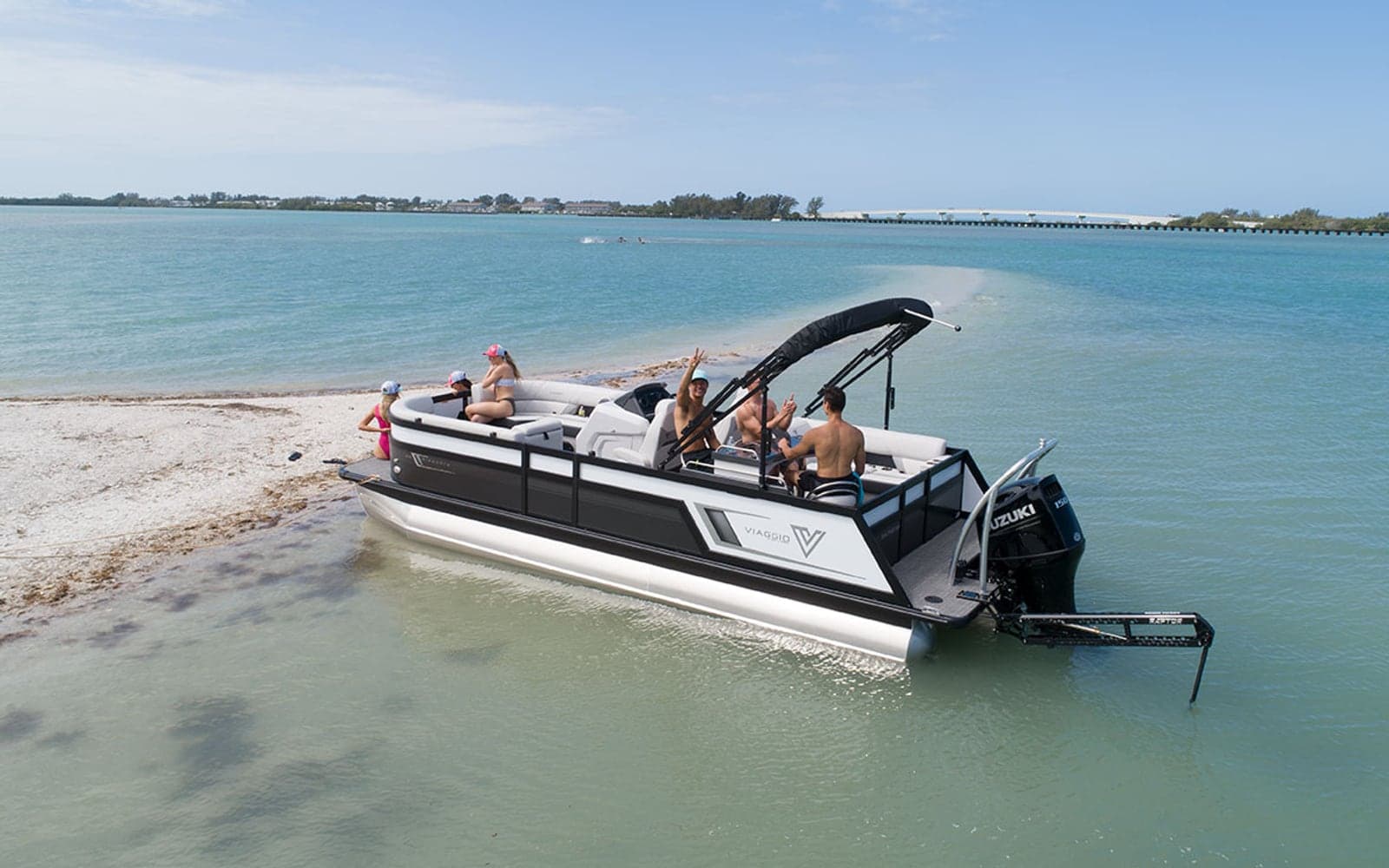 Family aboard an Island Breeze pontoon at a Clearwater Beach sandbar